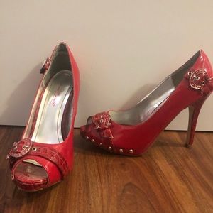 Red open toed snakeskin heels